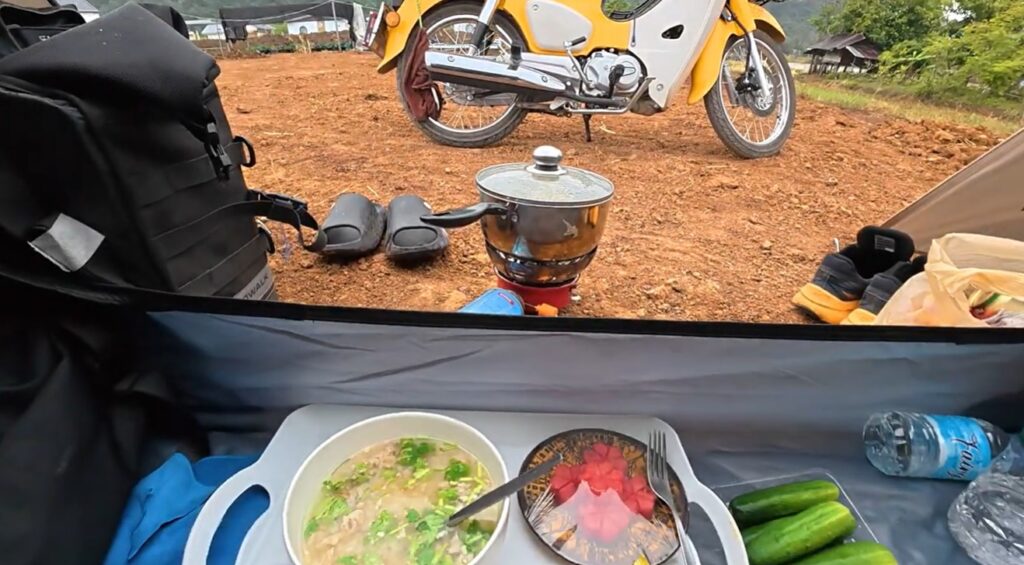 Breakfast at a campsite beneath the limestone mountains of Pha Man