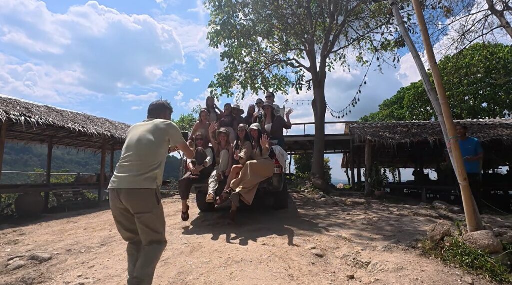 Honda Cub rider meeting Russian travelers at Khao Makhem campsite in Rayong