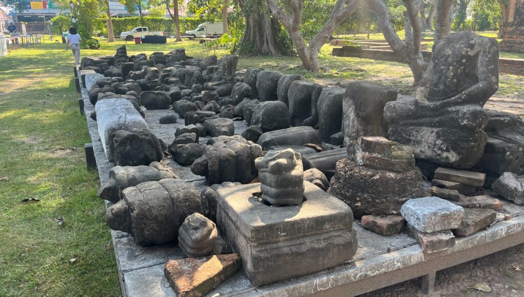 Collected stone fragments and architectural remains at Wat Phra Si Rattana Mahathat