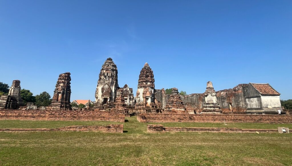 Wide view of ancient prangs and temple ruins at Wat Phra Si Rattana Mahathat in Lopburi