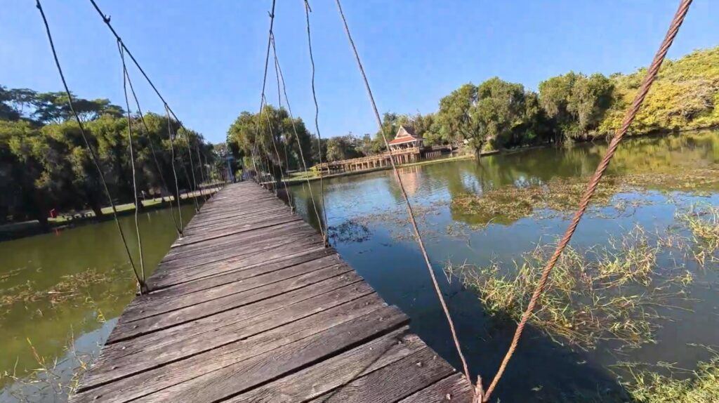 Peaceful pond and wooden pavilion at Sai Ngam Phimai