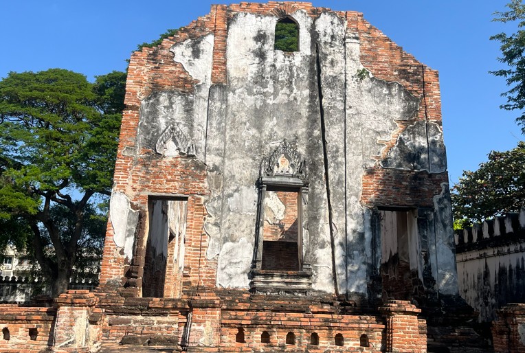 Ancient stucco face relief preserved at Wat Phra Si Rattana Mahathat in Lopburi