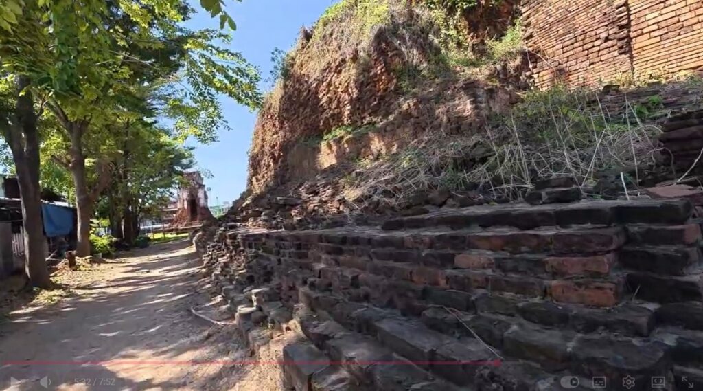 Weathered brick walls and ancient sanctuary remains at Wat Nakhon Kosa, Lopburi