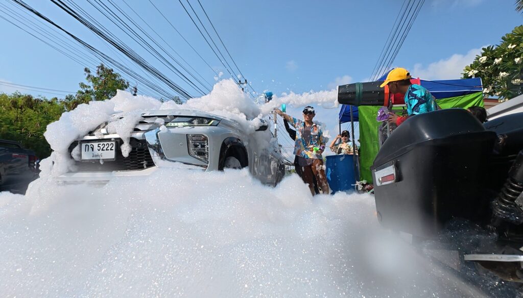 A pickup truck covered in foam during Songkran in Rayong