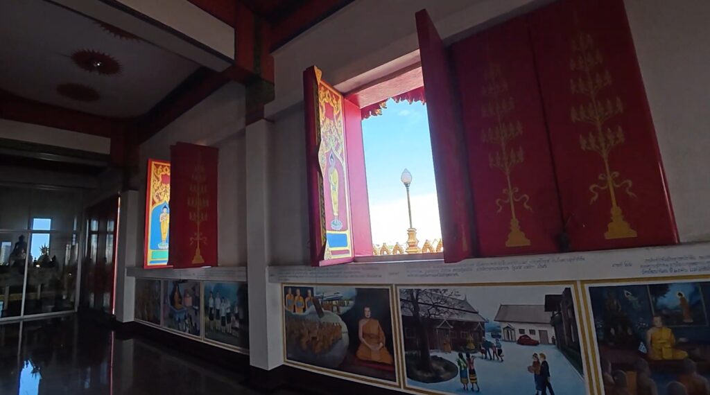 Golden Phra Mahathat Kaen Nakhon beneath the blue sky in Khon Kaen