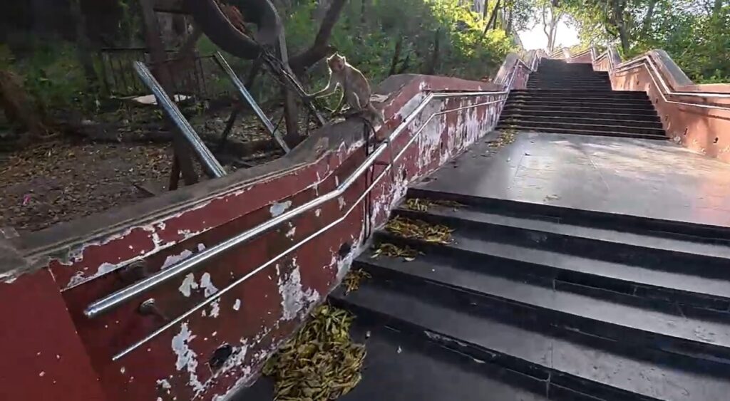 Steep stone staircase between rocks at Wat Phra Phutthachai