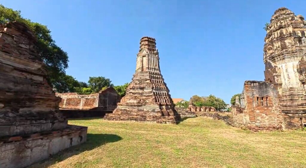 Ancient prang rising above the vast ruins of Wat Phra Si Rattana Mahathat in Lopburi