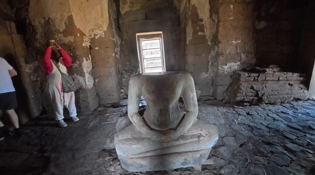 Buddha images inside Phra Prang Sam Yot showing later Theravada Buddhist use