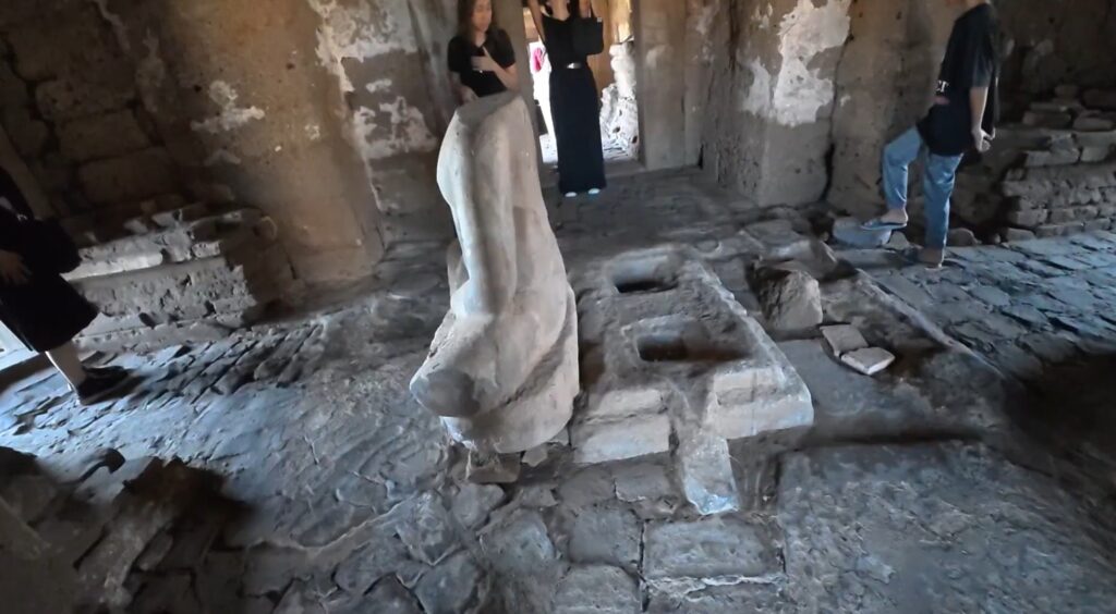 Headless seated Buddha inside Phra Prang Sam Yot in Lopburi, Thailand