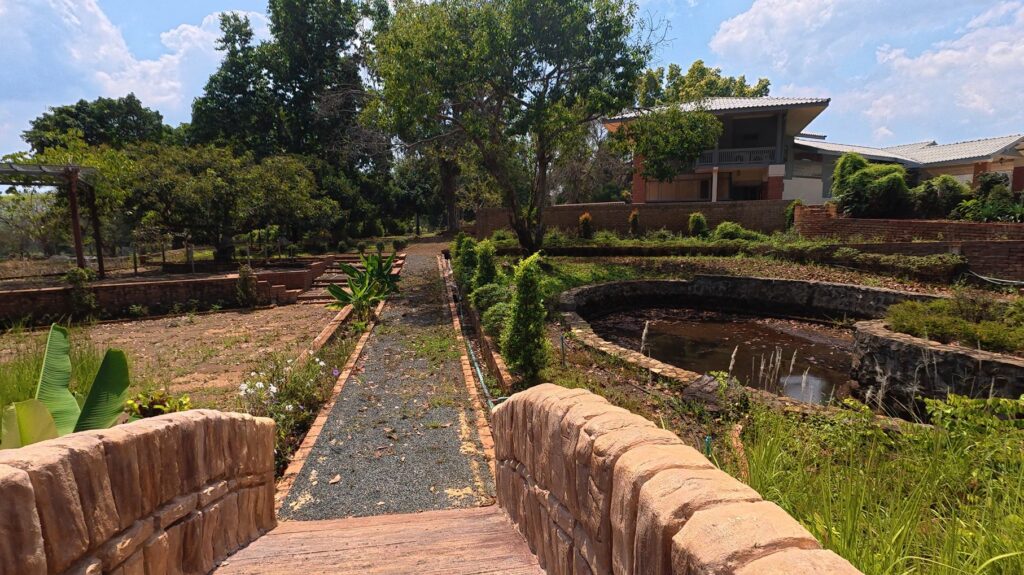 Stone bridge and reflecting pond at Suan Ban Kaew Palace