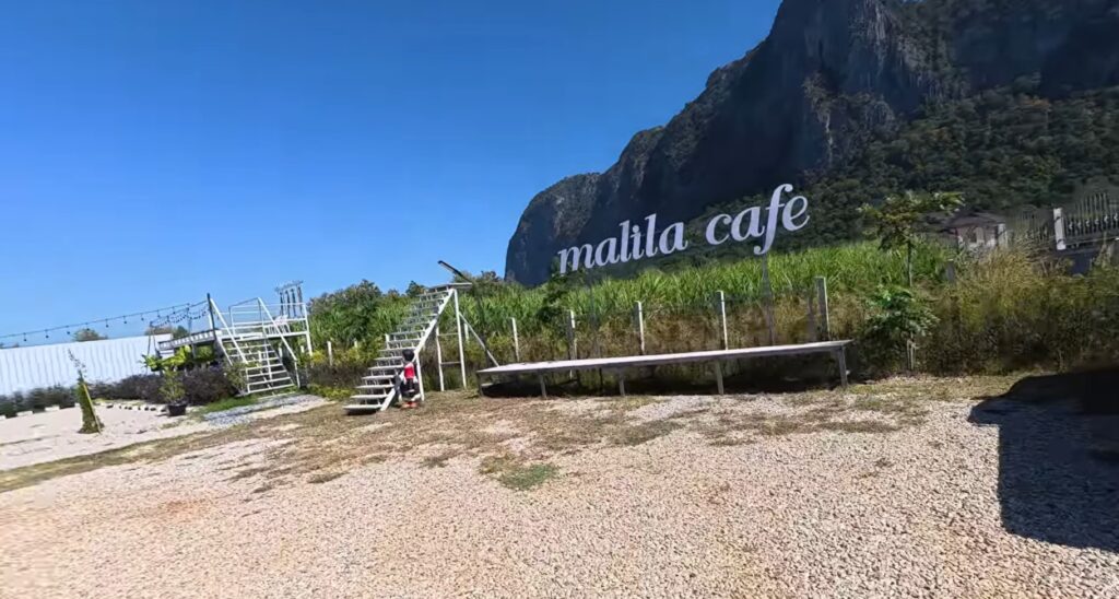 Small café beneath a limestone mountain in Sa Kaeo, Thailand