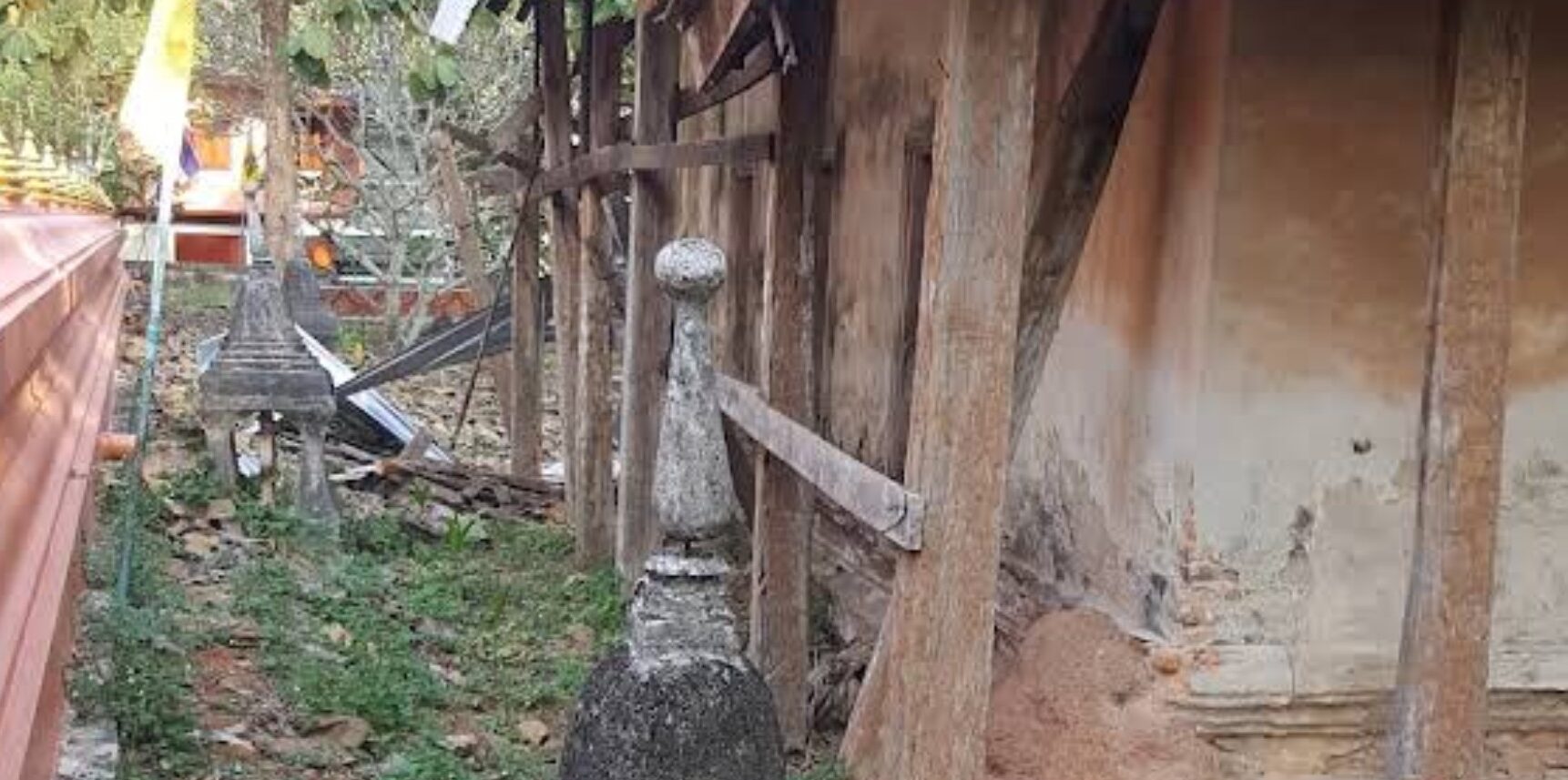Aged wooden wall and weathered details at Wat Thung Khwai Kin in Rayong