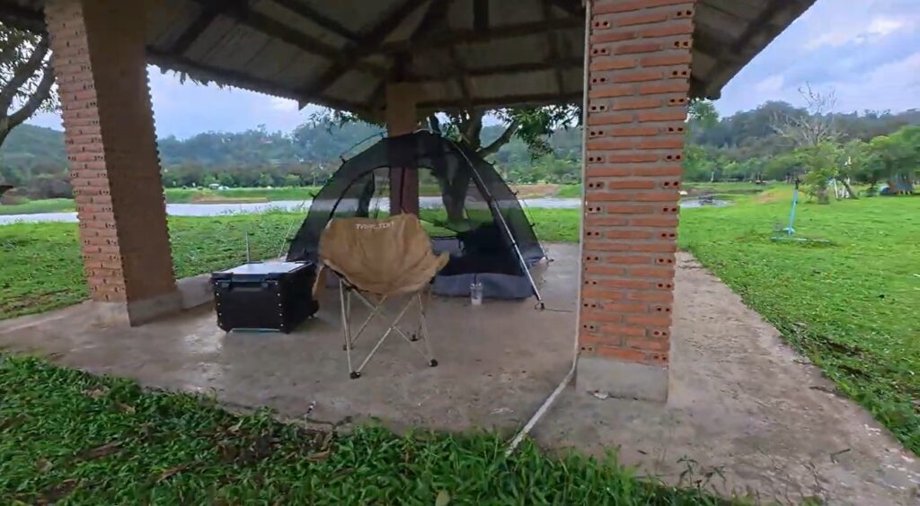 Honda Cub and camping setup at River Hill Camping in Rayong
Caption: The Honda Cub parked beside a simple campsite near Khao Chuk Reservoir.