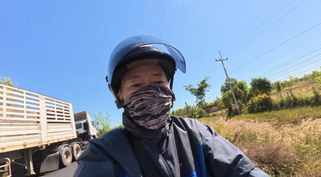 A beginner motorcycle rider traveling from Buriram to Roi Et through rural Isan