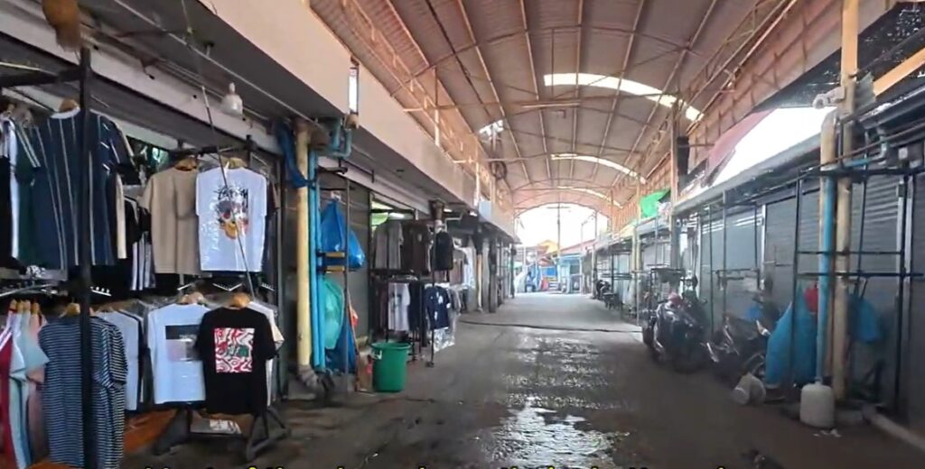 Nearly empty covered walkway inside Ban Khlong Luek Border Market