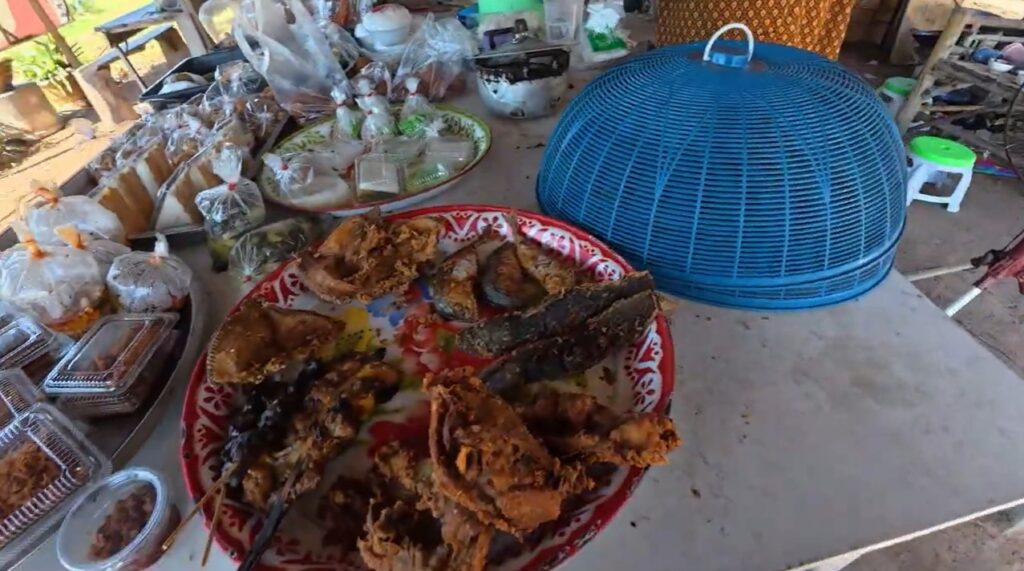 A simple local meal served at a small village shop in rural Isan