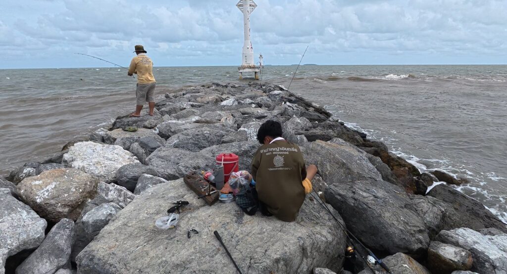Breakwater and lighthouse overlooking the Gulf of Thailand at Pak Nam Prasae