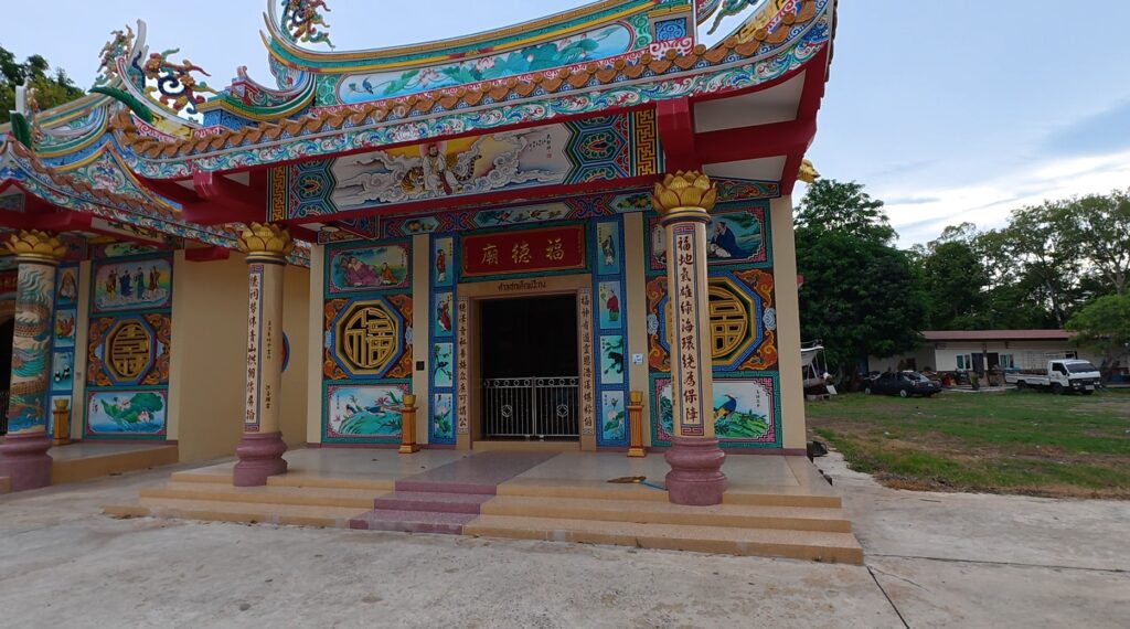 Colorful Chinese shrine with ornate roof decorations