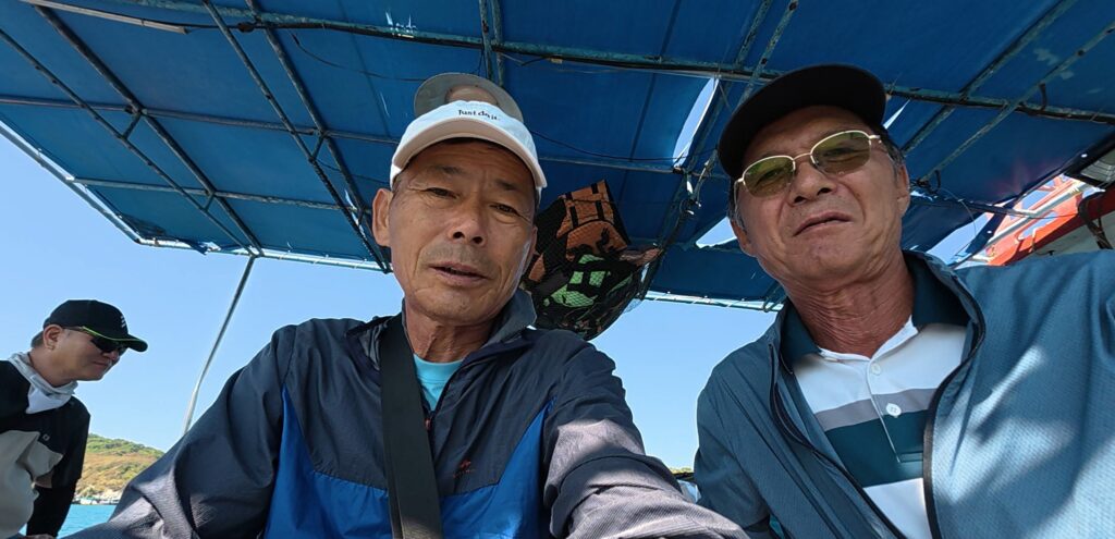 Friends relaxing together during a peaceful sea fishing trip
