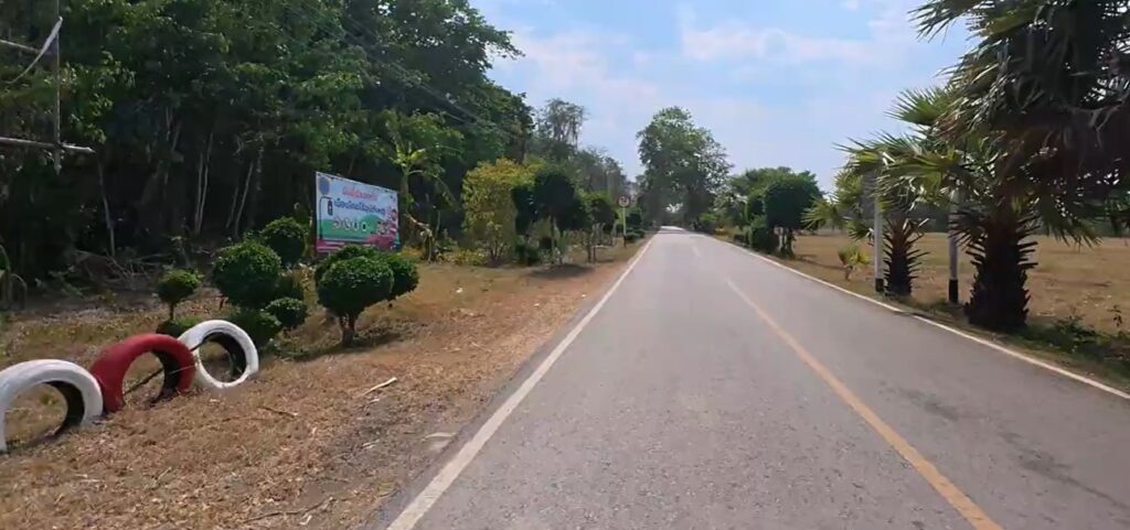 Riding south from Ban Khlong Luek toward Prasat Khao Noi