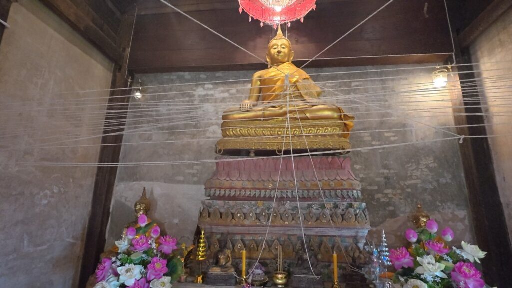 Historic Buddha image inside the old ubosot at Wat Ratchabanlang