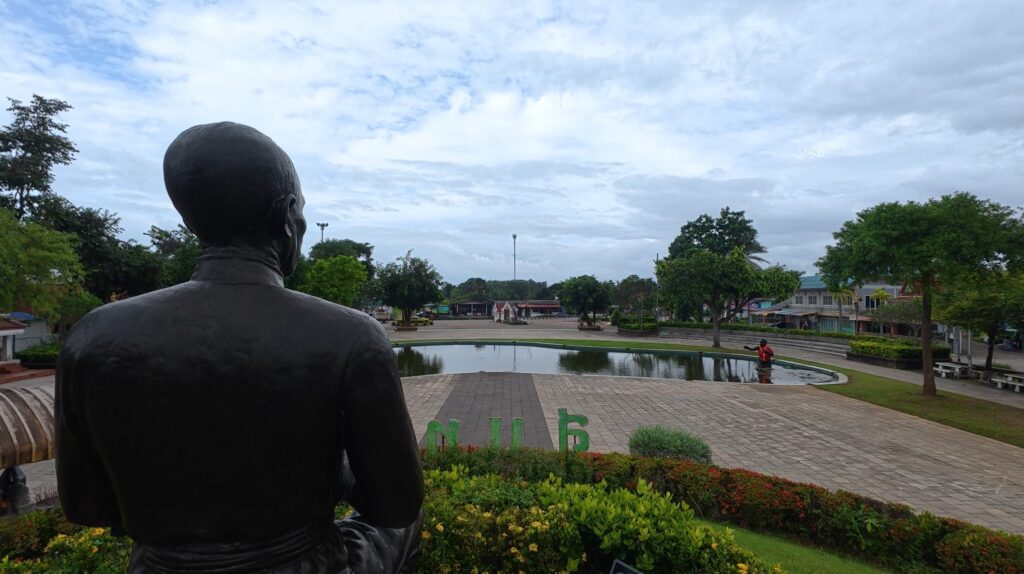 Arriving at the Sunthorn Phu Memorial in Rayong during a Honda Cub journey