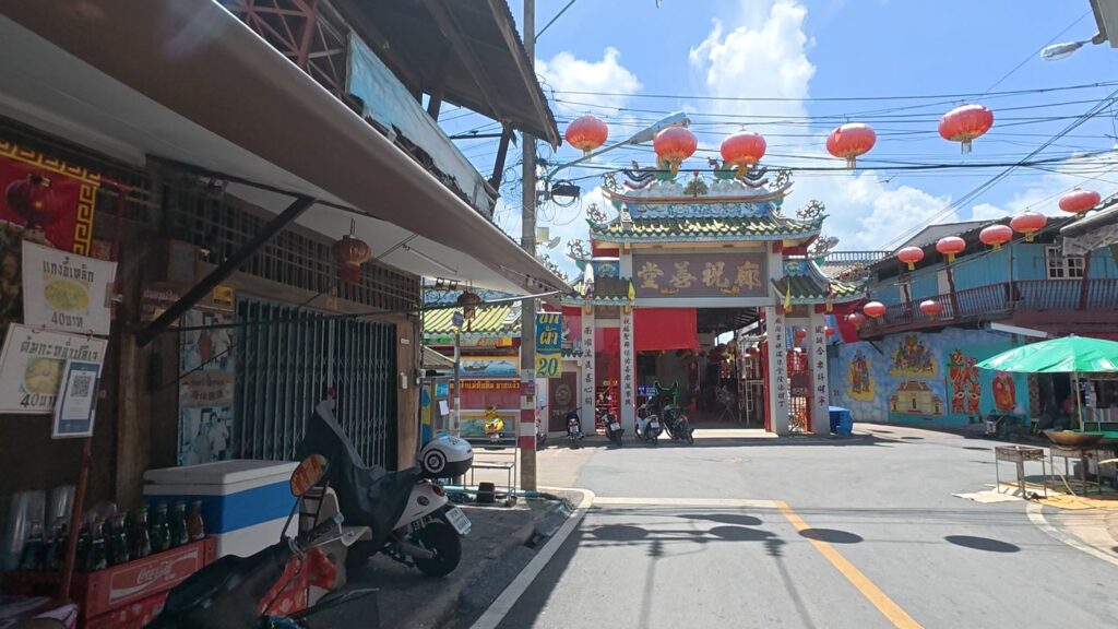 Red lanterns glowing above the historic street of Chak Ngaew Chinese Market