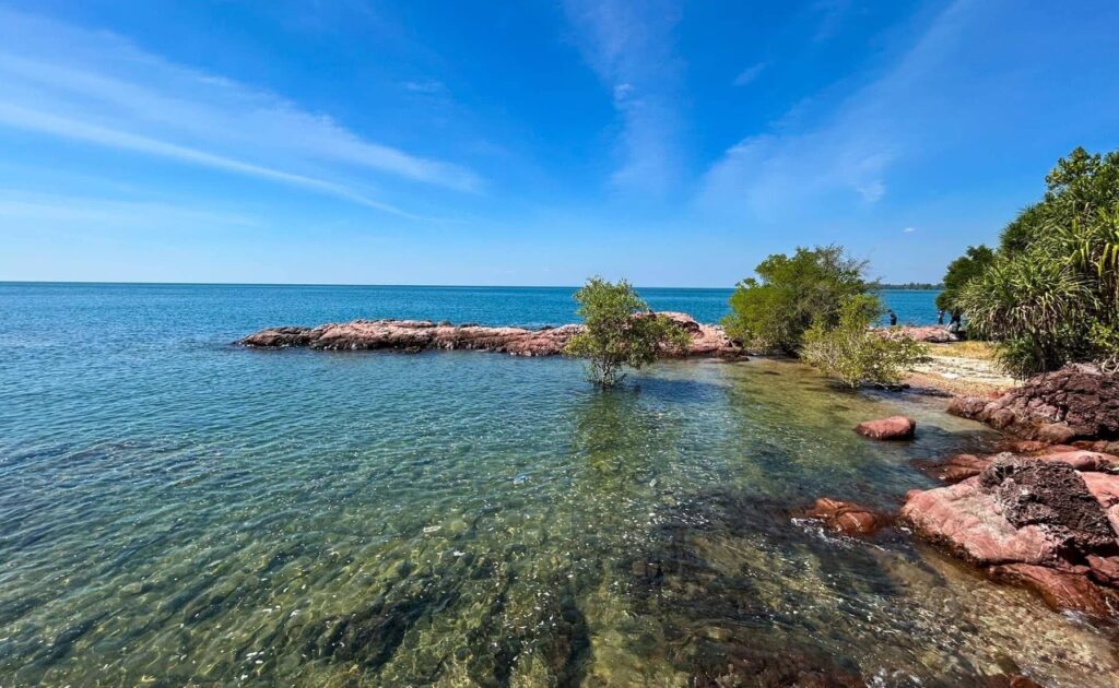 Lan Hin Chomphu Pink Coast with clear blue sea and reddish coastal rocks