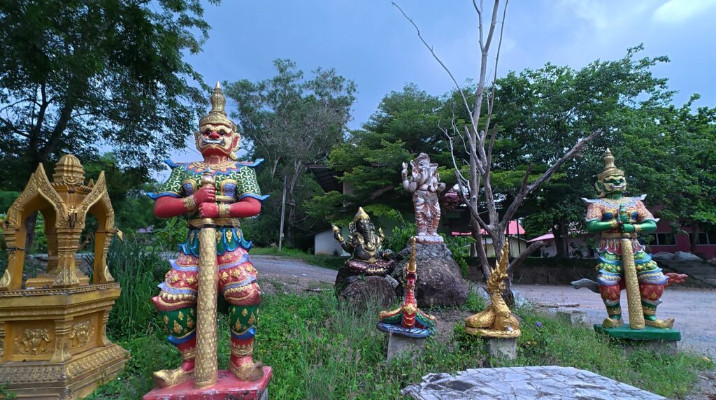 Yak guardian statue protecting the entrance to a sacred hall at Wat Ang Kaeo