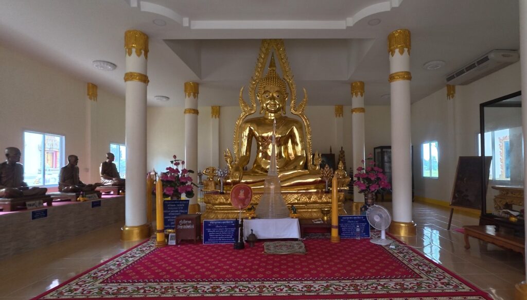 Buddha image inside the King Taksin memorial hall at Wat Ratchabanlang