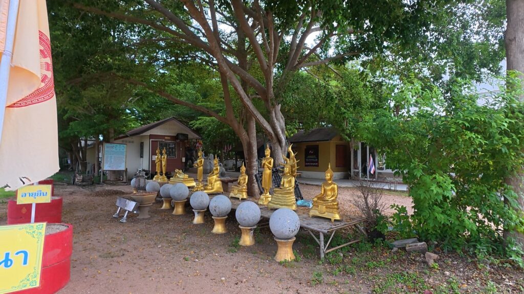 Buddha statues and sacred figures inside Anan Burapharam sanctuary