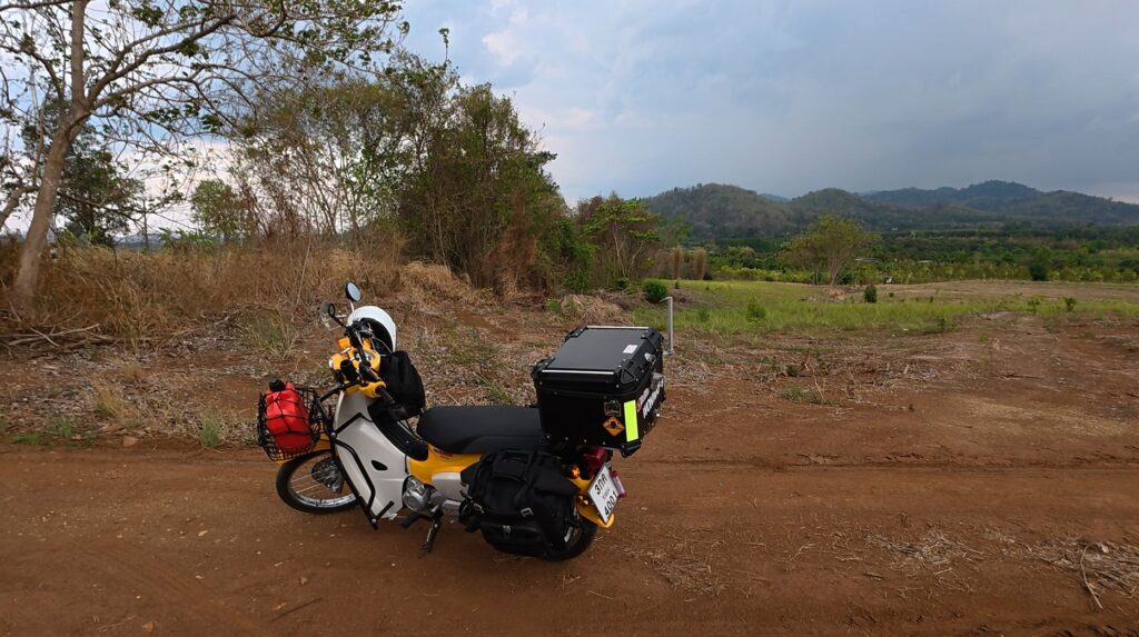 Wide open field on the return road from Ban Pakkad Border Checkpoint