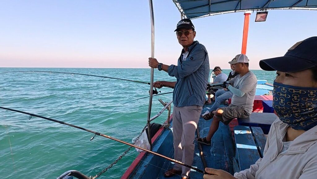 Sea Fishing in Thailand with friends on a small boat