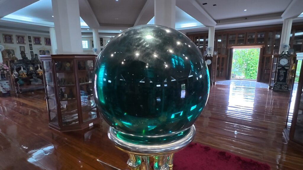 Emerald crystal sphere inside Wat Tham Wattana Mongkol in Rayong, Thailand