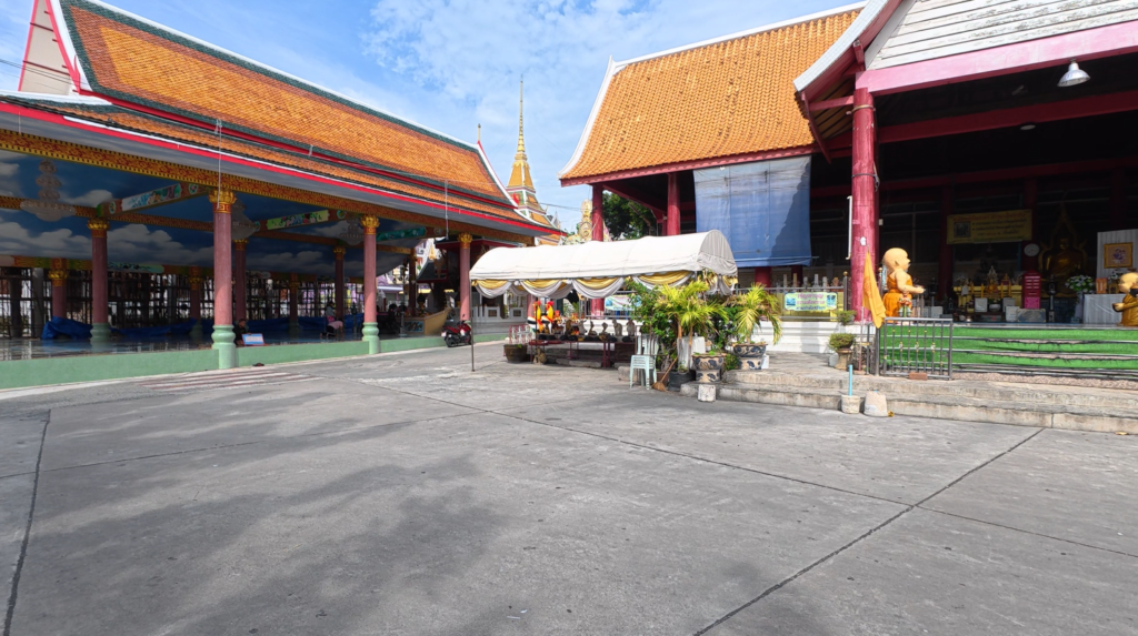 Courtyard and historic temple buildings at Wat Yai Intharam in Chonburi