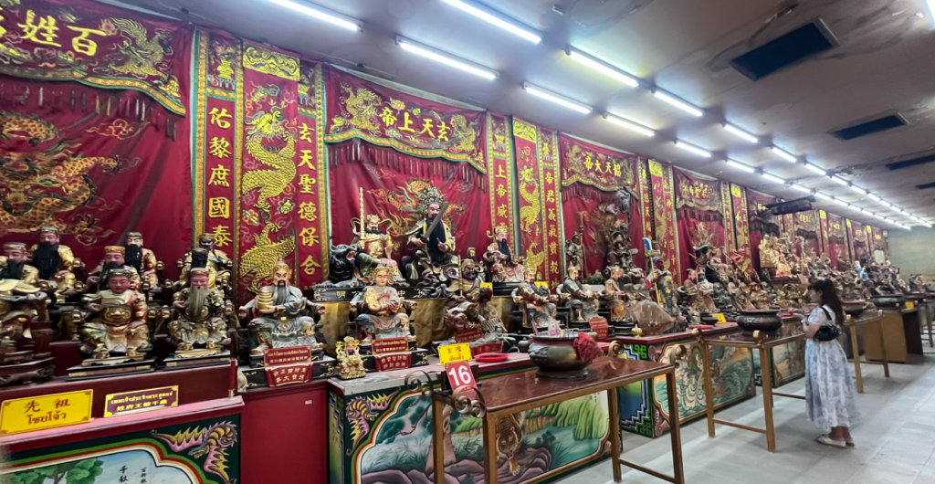 Long row of Chinese deity statues inside Na Jasa Tai Chue Shrine