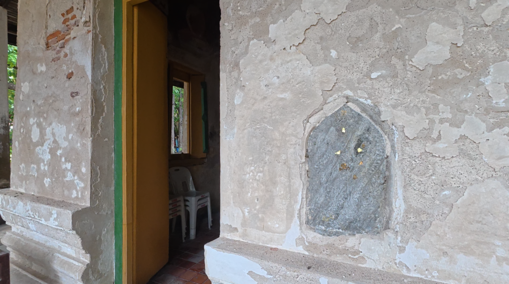 Bai sema boundary stone embedded in the wall of Wat Tan Lom’s old ubosot