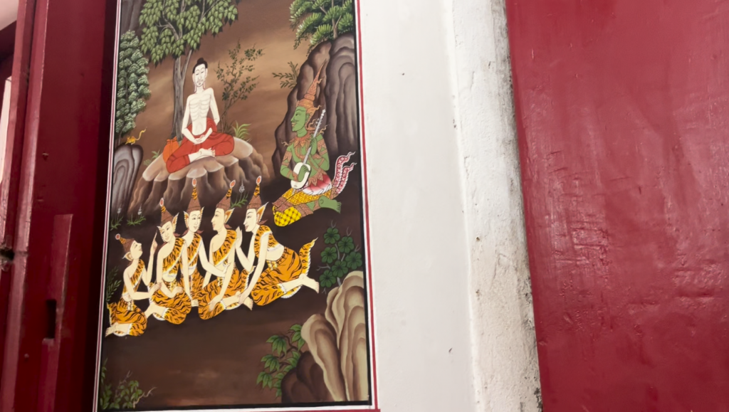 Restored Buddhist mural inside Wat Mai Ket Ngam’s old ubosot