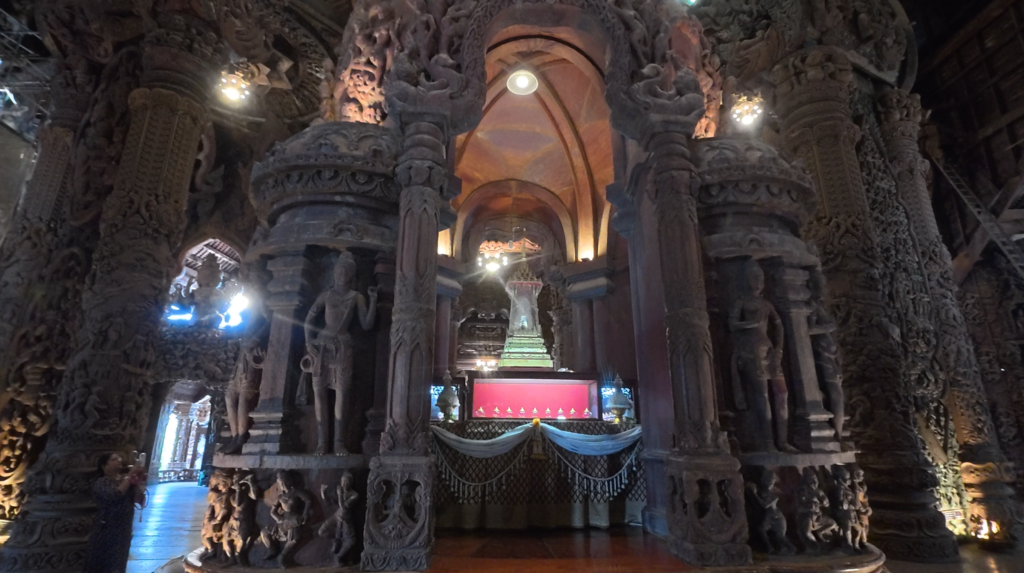 Central sacred pavilion surrounded by wooden carvings inside the Sanctuary of Truth