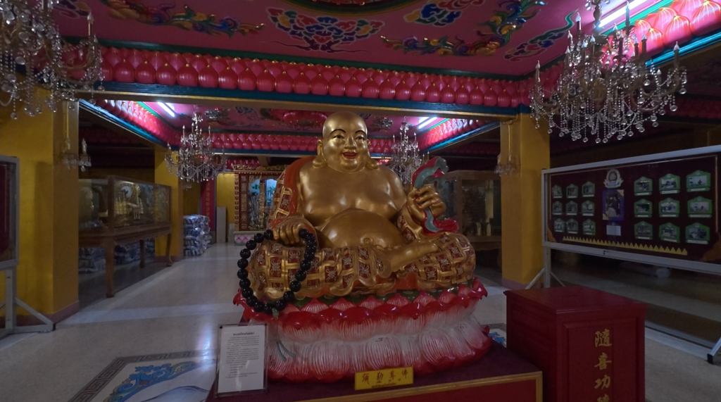 Laughing Buddha statue inside Na Jasa Tai Chue Shrine