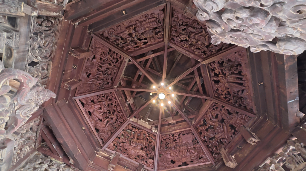 Intricately carved wooden ceiling at the center of the Sanctuary of Truth